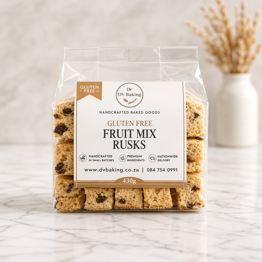 Packaged gluten-free fruit mix rusks with a visible brand label on a marble surface.